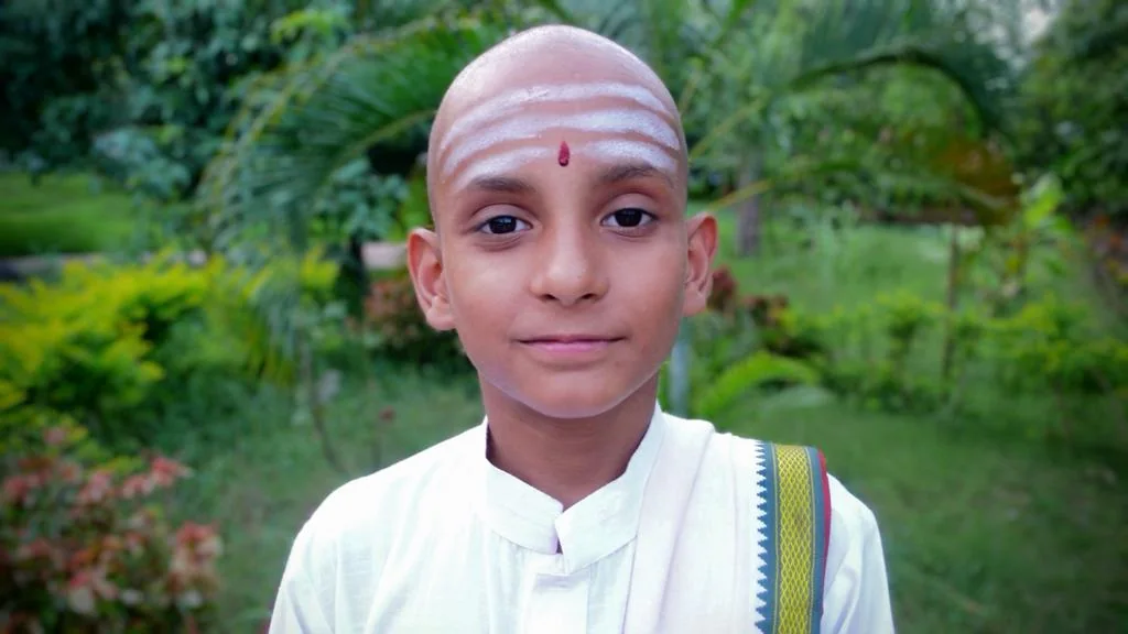 Pandit Dipanshu Barvariya at age ten in traditional clothing